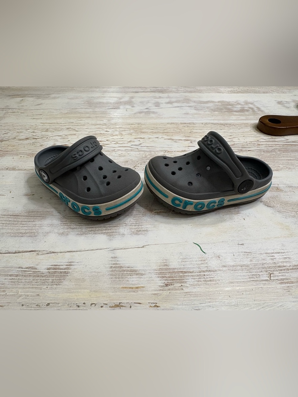 CROCS Kids Classic Clog in Black with Teal Trim